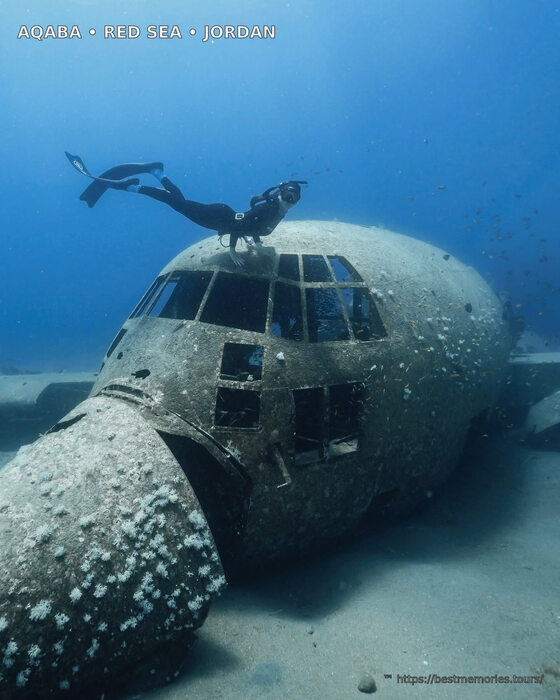 Scuba diver exploring an underwater wreck and artificial reef in the Red Sea near Aqaba, Jordan