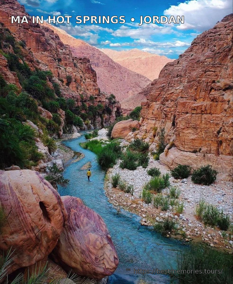 Freshwater stream through a red sandstone canyon near Jordan's Ma'in valley