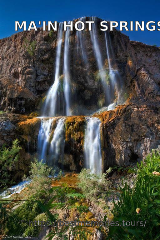 Layered thermal waterfall and desert canyon landscape at Ma'in, Jordan