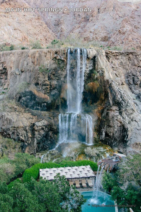 Thermal waterfall and pool terrace in the desert canyon at Ma'in, Jordan