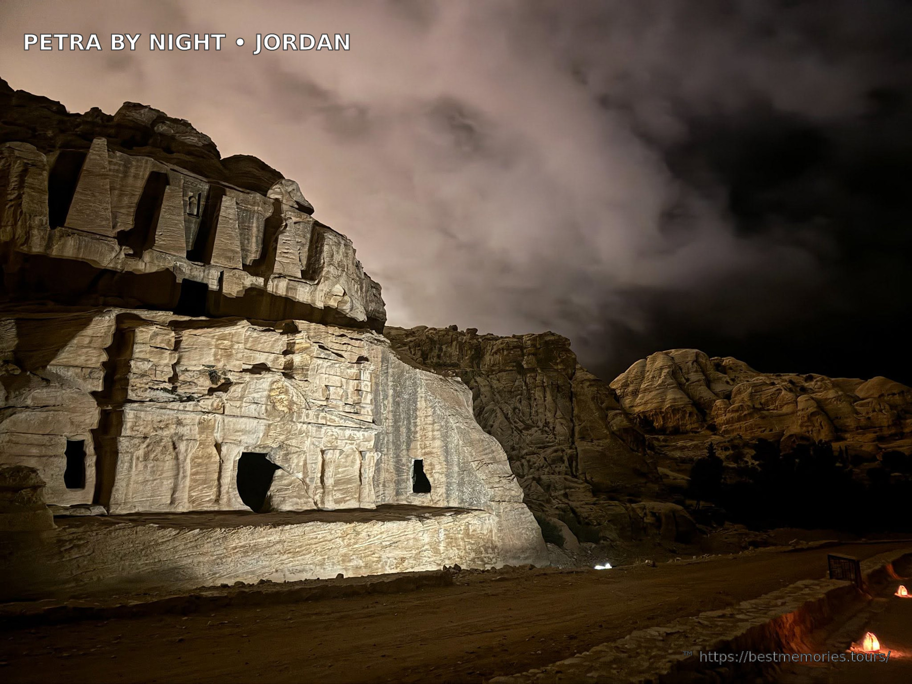 Petra rock tombs illuminated by candlelight during an evening visit in Jordan