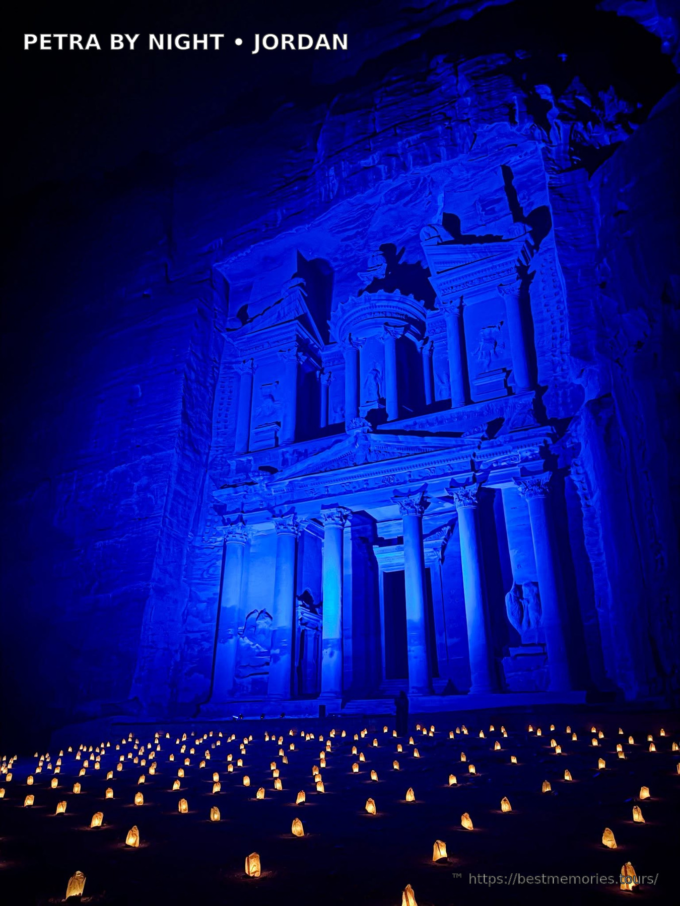 Blue illuminated Petra Treasury facade during a Petra by Night show in Jordan