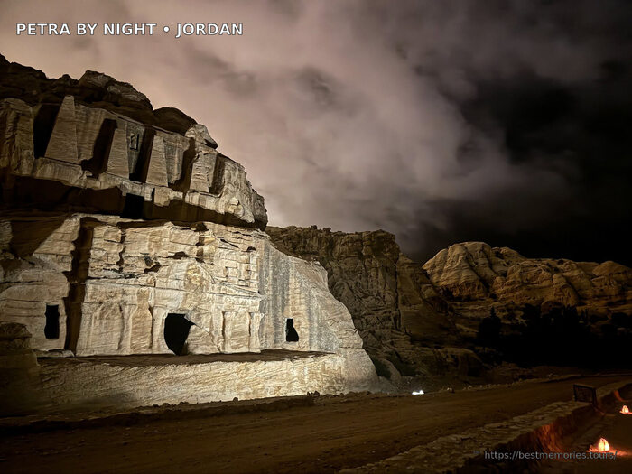 Petra rock tombs illuminated by candlelight during an evening visit in Jordan