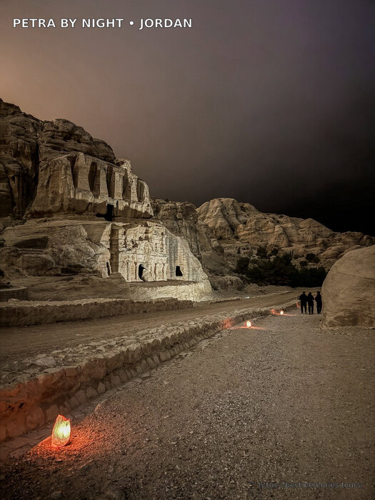 Candlelit trail beside Petra rock-cut tombs in Wadi Musa, Jordan