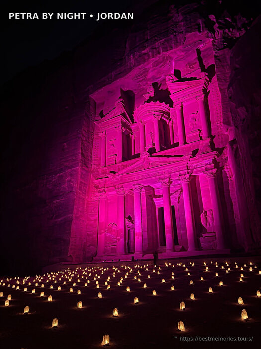 Pink-lit Petra Treasury and candle field during Petra by Night in Wadi Musa