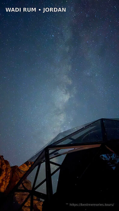 Star-filled sky above a glass-roof camp in Wadi Rum, Jordan